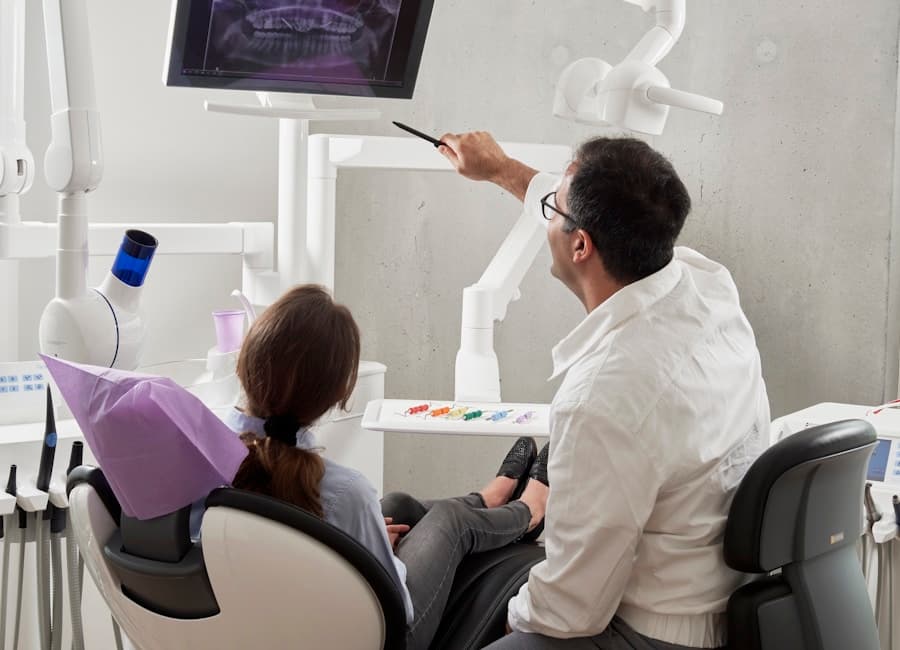 Dentist explaining a dental X-ray before root canal treatment in Hennur